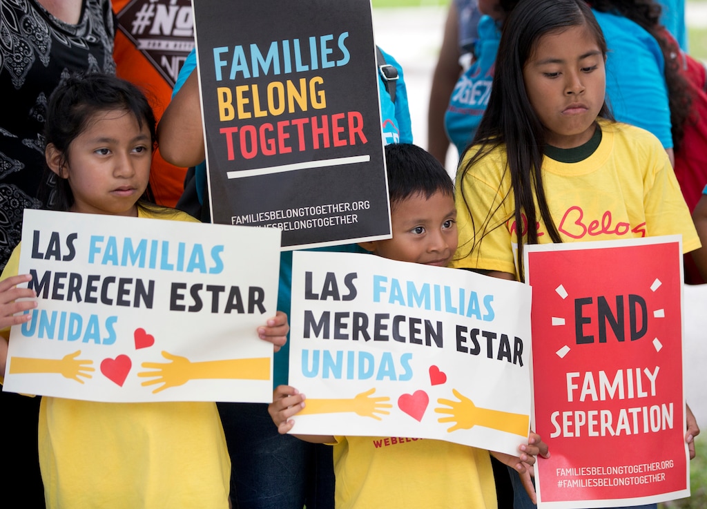 (AP Photo/Wilfredo Lee, File) In this June 1, 2018, file photo, children hold signs during a demonstration in front of the Immigration and Customs Enforcement offices in Miramar, Fla. The Trump administration's move to separate immigrant parents from their children on the U.S.-Mexico border has turned into a full-blown crisis in recent weeks, drawing denunciation from the United Nations, Roman Catholic bishops and countless humanitarian groups.
