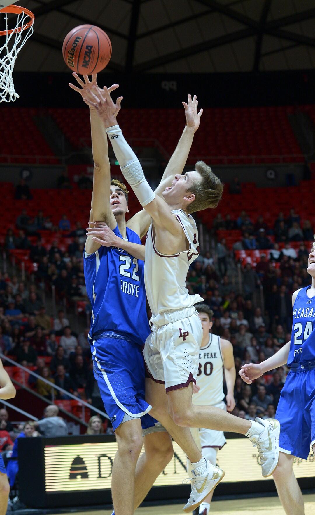 (Leah Hogsten  |  The Salt Lake Tribune) Lone Peak's Steven Ashworth (03) slips past Pleasant Grove's Matt Van Komen (22). Pleasant Grove plays Lone Peak to win the 6A High School BoysÕ Basketball Tournament Championship at the Jon M. Huntsman Center in Salt Lake City, Saturday, March 3, 2018. 