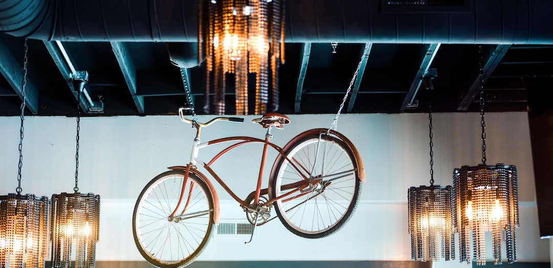 (Leah Hogsten | The Salt Lake Tribune) Vintage bicycles hang from the ceiling at HandleBar, in Salt Lake City.