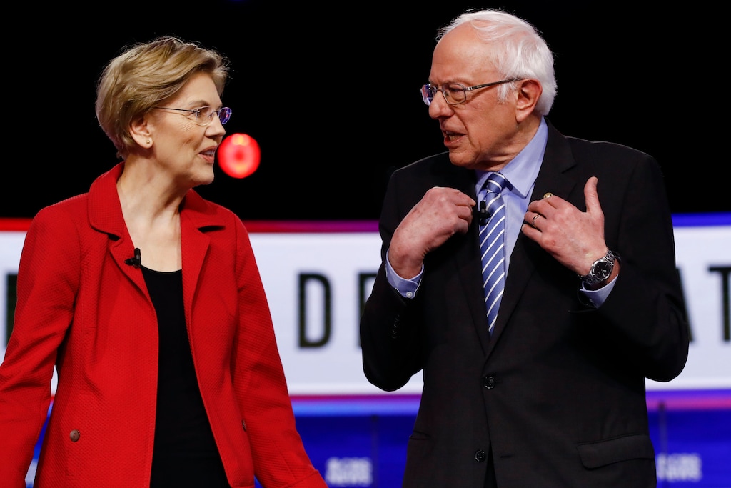 Democratic presidential candidates, Sen. Elizabeth Warren, D-Mass., and Sen. Bernie Sanders, I-Vt., talk before a Democratic presidential primary debate, Tuesday, Feb. 25, 2020, in Charleston, S.C. (AP Photo/Matt Rourke)