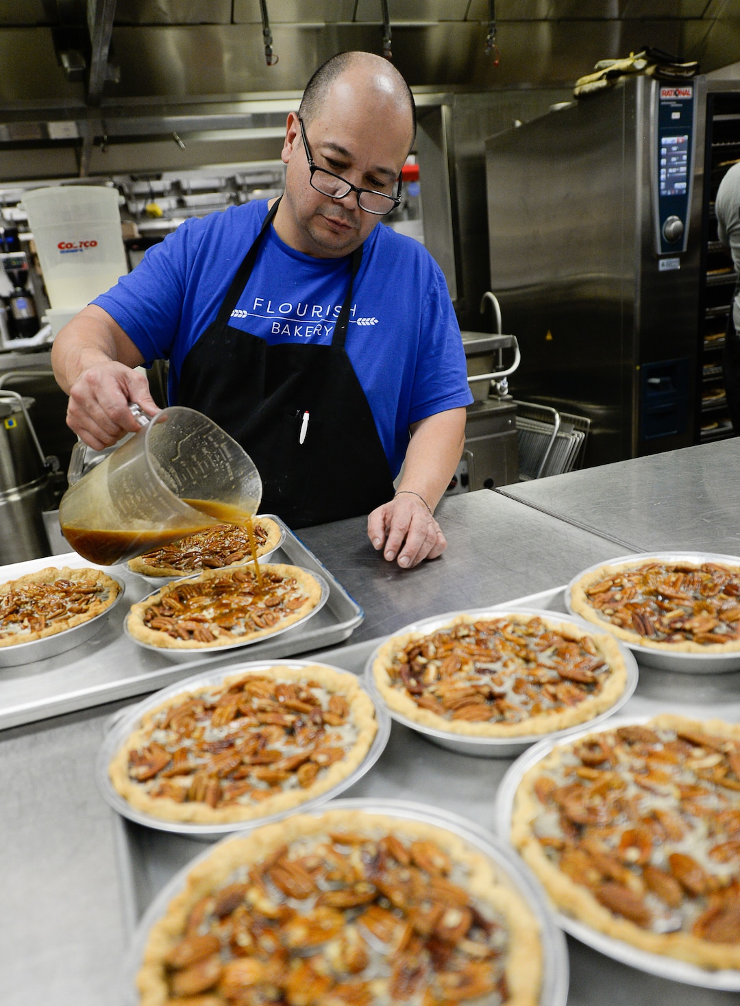 (Francisco Kjolseth  |  The Salt Lake Tribune)  Dennis Sisneros, an intern at Flourish Bakery prepares pecan pies for the oven during a rush to fulfill a large order before the Thanksgiving holiday on Tuesday, Nov. 26, 2019. Flourish Bakery needs to find a new home before Christmas. The non-profit bakery teaches those who have been incarcerated or recovering from substance abuse the art of baking. The skills they learn help them get a job and become financially independent. The bakery has been housed at SLCC's South City campus, but the college has said they can no longer use the space.