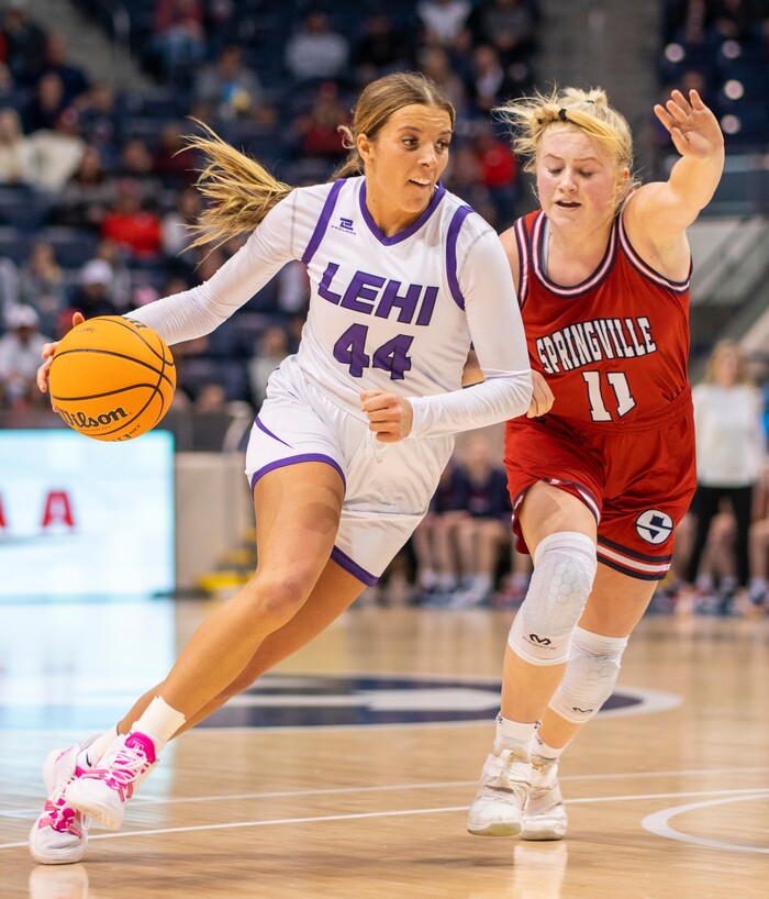 (Rick Egan | The Salt Lake Tribune) Lehi forward, Jamisyn Heaton (44) takes the ball downcourt, as Springville Red Devils, Ashleigh Mousser (11) defends, in the girls 5A State Championship game between the Springville Red Devils and the Lehi Pioneers, at the Marriott Center in Provo, on Saturday, March 5, 2022. 
