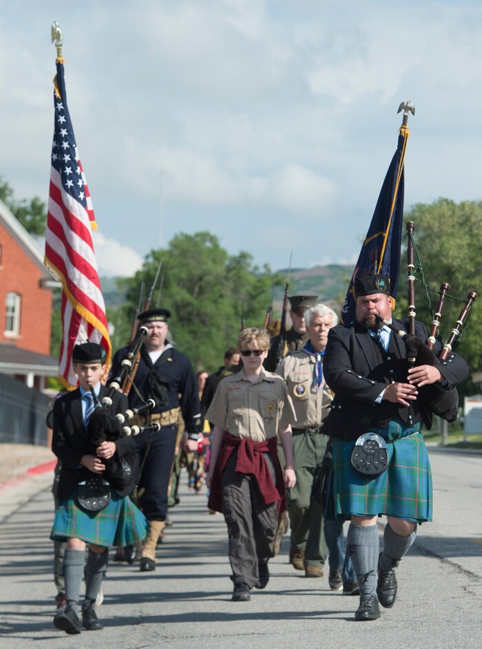 (Rick Egan  |  The Salt Lake Tribune)      
Bagpipers Zera and Tom McOmie lead the Utah Military History Group as they march to the Fort Douglas Cemetery for the Memorial Day observance Monday, May 28, 2018.


