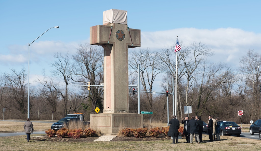 (Kevin Wolf | The Associated Press)  Visitors walk around the 40-foot Maryland Peace Cross dedicated to World War I soldiers on Wednesday, Feb. 13, 2019 in Bladensburg, Md.