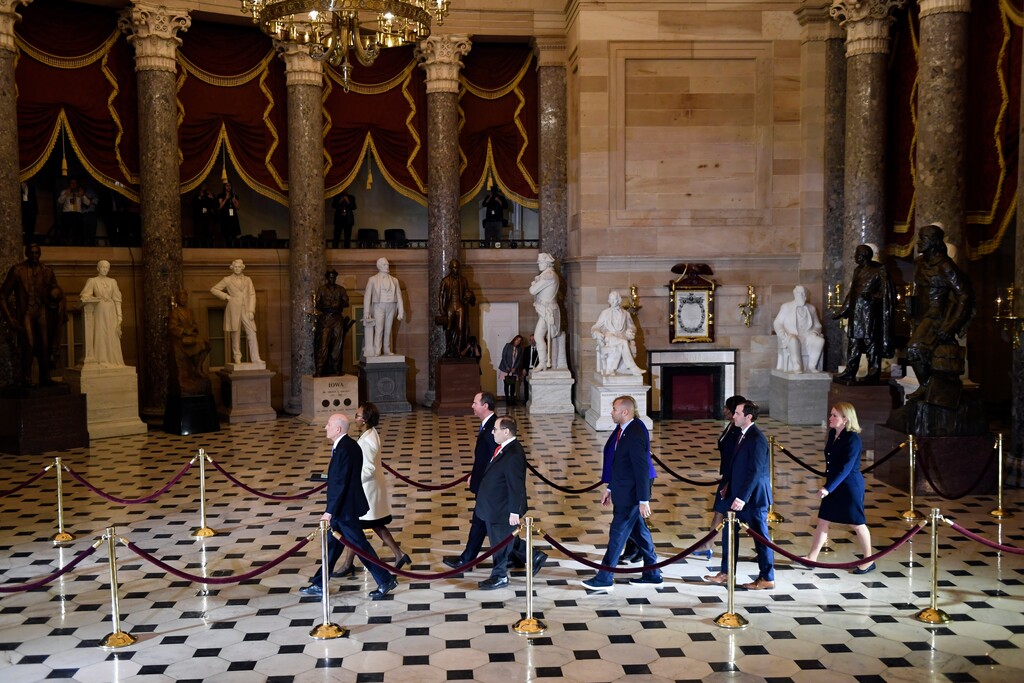 (Susan Walsh | AP) House Sergeant at Arms Paul Irving and Clerk of the House Cheryl Johnson, walk back to the House after delivering the articles of impeachment against President Donald Trump to the Senate on Capitol Hill in Washington, Wednesday, Jan. 15, 2020. Following are impeachment managers, House Judiciary Committee Chairman, Rep. Jerrold Nadler, D-N.Y., House Intelligence Committee Chairman Adam Schiff, D-Calif., Rep. Hakeem Jeffries, D-N.Y., Rep. Sylvia Garcia, D-Texas, Rep. Val Demings, D-Fla., Rep. Zoe Lofgren, D-Calif., and Rep. Jason Crow, D-Colo.