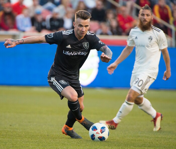 (Rick Egan  |  The Salt Lake Tribune)    Real Salt Lake midfielder Albert Rusnak (11) kicks the ball, as Colorado Rapids midfielder Enzo Martinez (90) defends, in MLS soccer action, RSL vs Colorado Rapids at Rio Tinto Stadium, Saturday, April 21, 2018.


