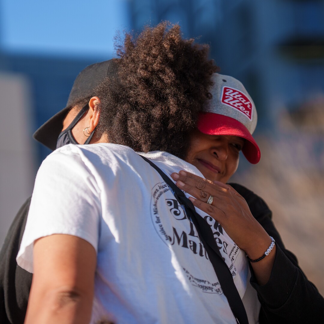 (Trent Nelson  |  The Salt Lake Tribune) Rae Duckworth and Lex Scott embrace as people rally at the Public Safety Building in Salt Lake City on Tuesday, April 20, 2021 to mark the conviction of Derek Chauvin for the murder of George Floyd.