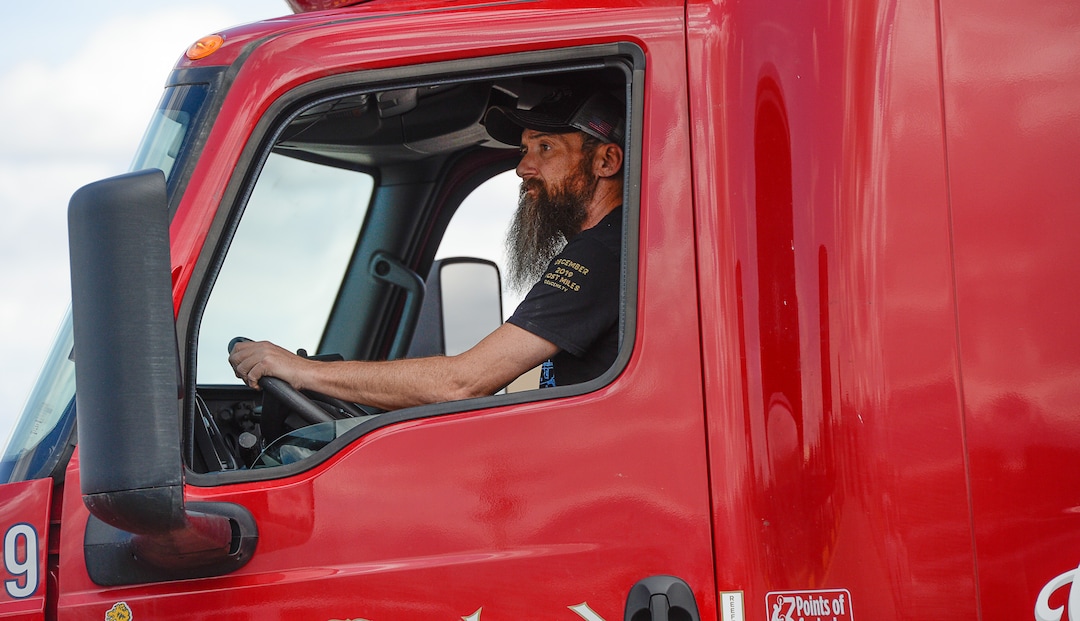 (Francisco Kjolseth  |  The Salt Lake Tribune) Trucks come and go at C.R. England trucking in Salt Lake City on Monday, March 30, 2020. The coronavirus outbreak has helped make truckers heroes as they help to stock empty shelves in stores. Drivers face new challenges from finding restrooms and food on the road amid shutdowns, but say they enjoy driving with no congestion.