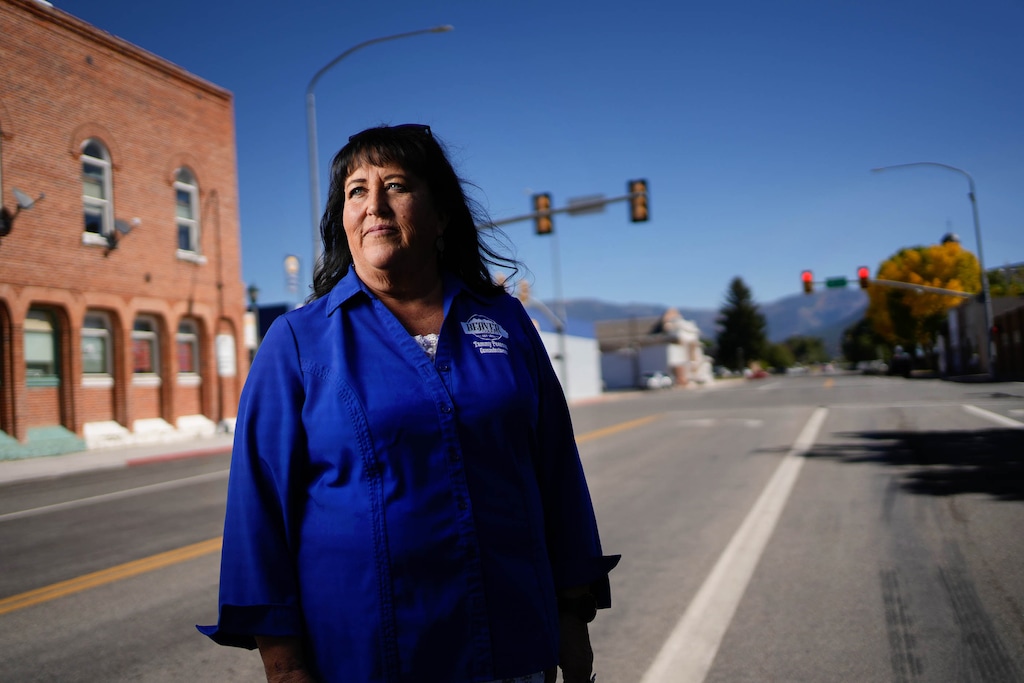 (Francisco Kjolseth | The Salt Lake Tribune) Tammy Pearson, Beaver County Commissioner serving her third term in office and a 40-year resident of the county, stands for a portrait by the county’s sole stoplight at the intersection of Center Street and Main on Thursday, Oct. 5, 2023.