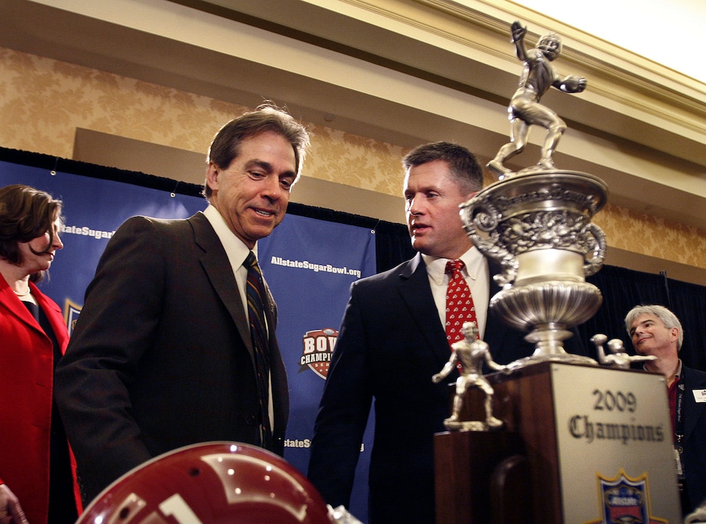 (Scott Sommerdorf / The Salt Lake Tribune) Utah coach Kyle Whittingham (R), and Alabama coach Nick Saban met and posed for photos with the Sugar Bowl trophy at a press conference before the 2009 Sugar Bowl. Saban this week announced he was retiring.