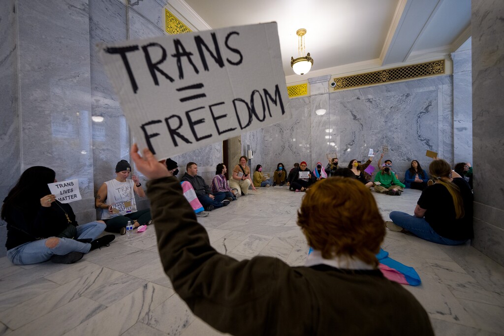 (Trent Nelson  |  The Salt Lake Tribune) Activists in support of transgender rights hold a sit-in in front of a bathroom at the Utah Capitol in Salt Lake City on Thursday, Feb. 22, 2024.