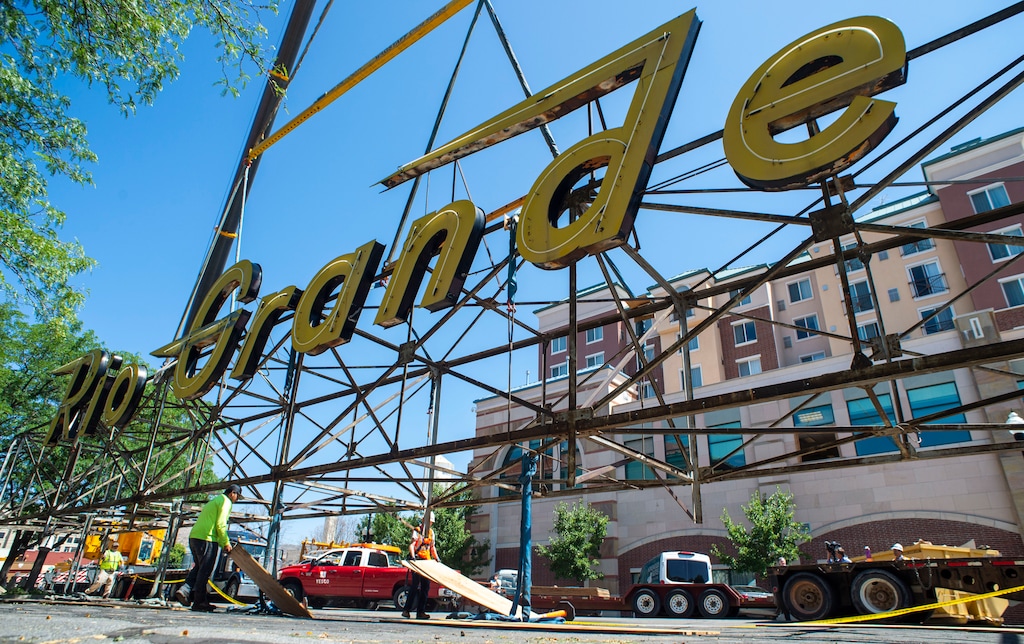 (Rick Egan  |  The Salt Lake Tribune)     The neon Rio Grande sign that has shined from the rooftop of the Rio Grande Depot for more than 50 years is removed from the building, Monday, Aug. 12, 2019.


