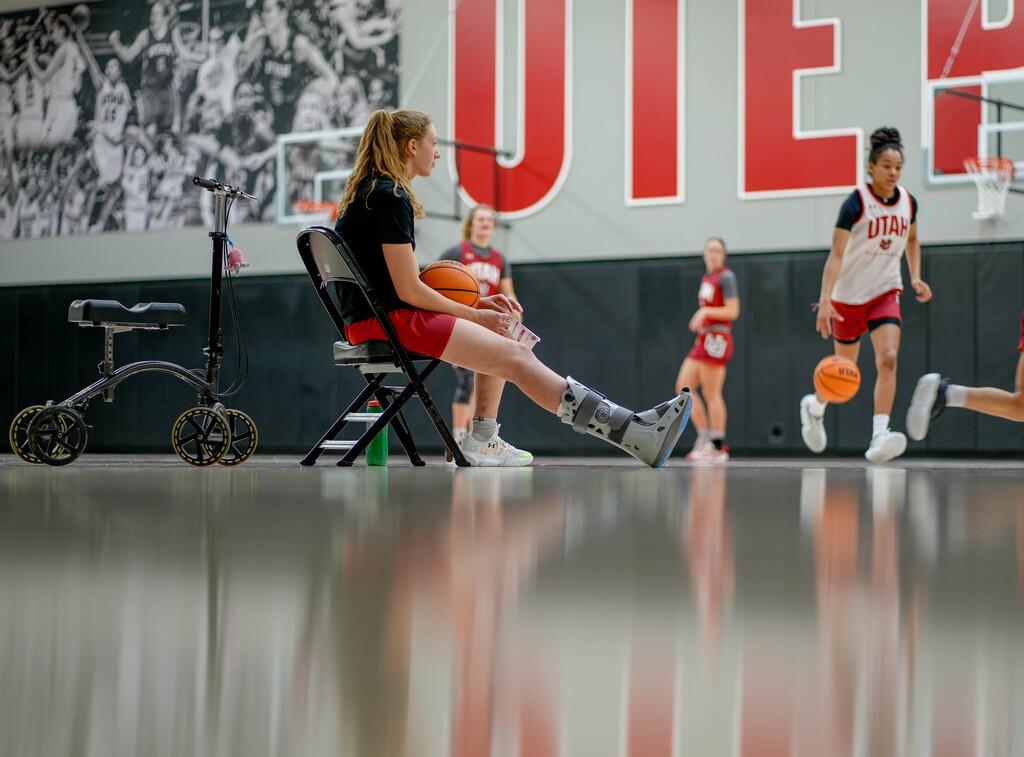(Francisco Kjolseth  |  The Salt Lake Tribune) Utah basketball player Gianna Kneepkens takes a brief break as she watches her teammates run through drills on Wednesday, Jan. 24, 2024. Kneepkens broke multiple bones in her foot during a game on Dec. 2. 
