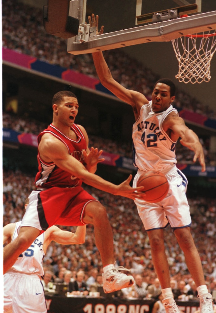 (Trent Nelson  |  Tribune file photo) Utah's David Jackson tries to pass around Kentucky's Jamaal Magloire in the 1998 championship game in San Antonio, Texas.