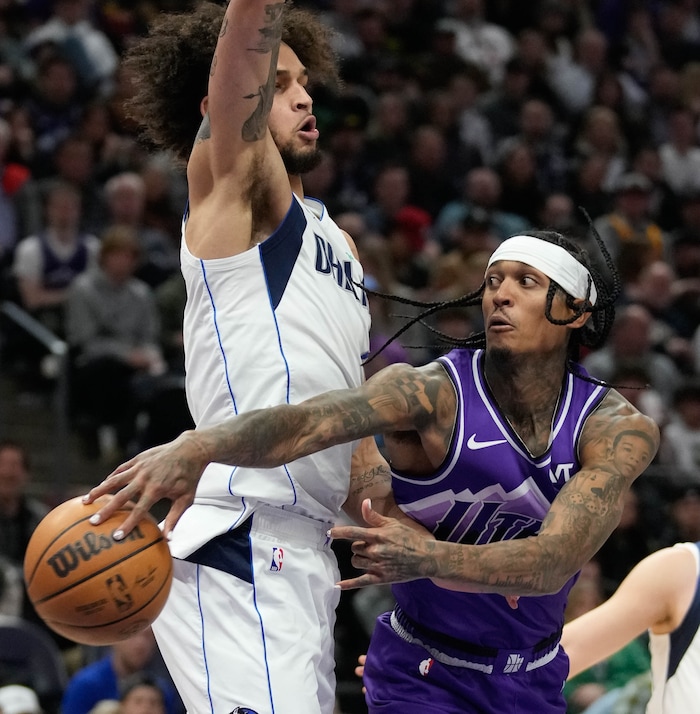 (Francisco Kjolseth  |  The Salt Lake Tribune) Utah Jazz guard Jordan Clarkson (00) passes the ball around Dallas Mavericks center Dereck Lively II (2) during an NBA basketball game Monday, March 25, 2024, in Salt Lake City.