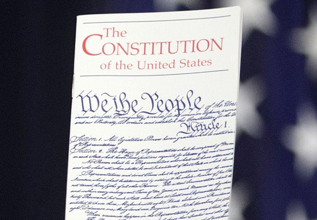 (J. Scott Applewhite | AP) The Constitution is held by a member of Congress on Capitol Hill in Washington in 2016.