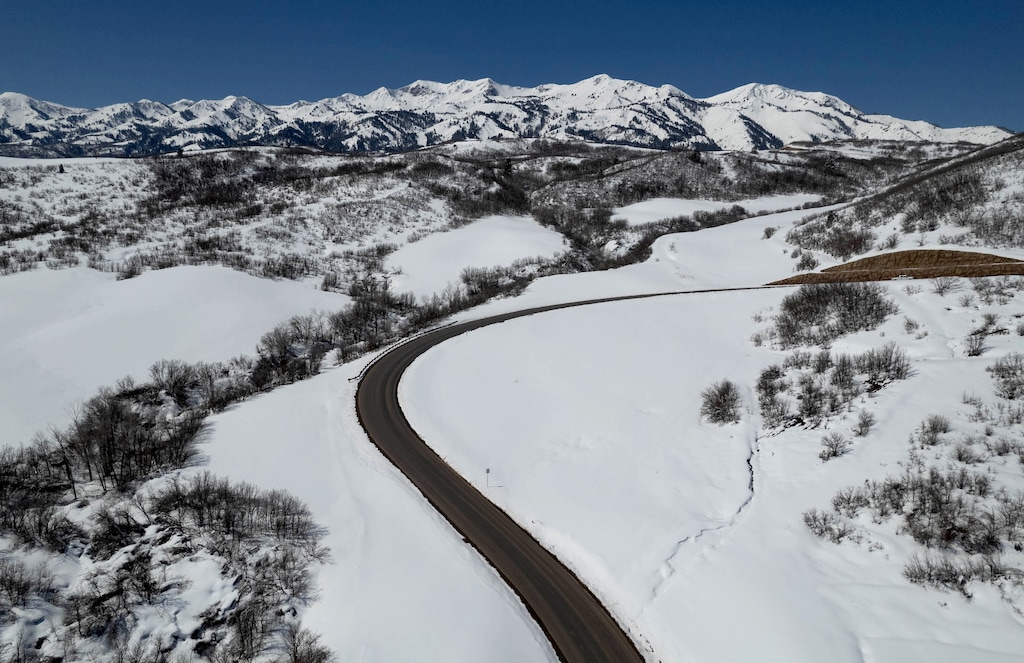 (Francisco Kjolseth | The Salt Lake Tribune) Sloping eastward into Morgan County from just below a string of 24 mountaintops, the exclusive playground of Wasatch Peaks Ranch, pictured on Friday, April 7, 2023, is emerging. The private drive snakes up to where a development, catering to richest ‘1% of the 1%’ is approved for 750 residential units, will come with a Tom Fazio golf course, a village and numerous amenities, including 70 miles of trails for residents’ exclusive use.