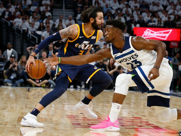 Minnesota Timberwolves' Jimmy Butler, right, tries to reach the ball as Utah Jazz's Ricky Rubio, of Spain, drives during the first half of an NBA basketball game Friday, Oct. 20, 2017, in Minneapolis. AP Photo/Jim Mone)