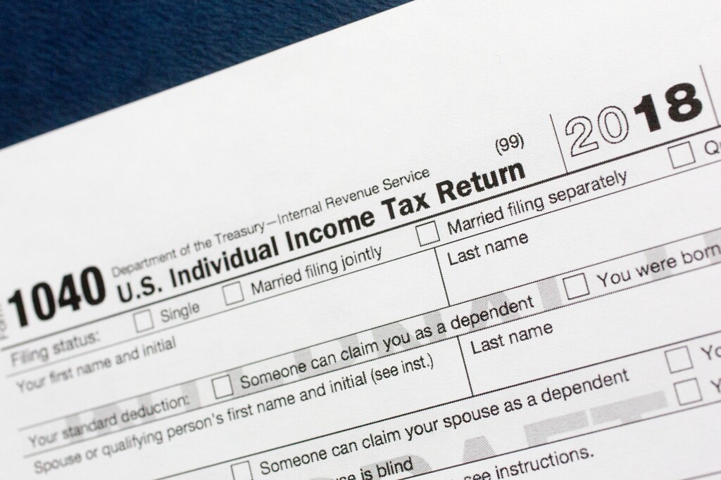 (AP Photo/Mark Lennihan) A portion of the 1040 U.S. Individual Income Tax Return form for 2018 is displayed, Tuesday, July 24, 2018, in New York. The $1.5-trillion tax overhaul includes the end of a 75-year-old deduction on alimony payments.