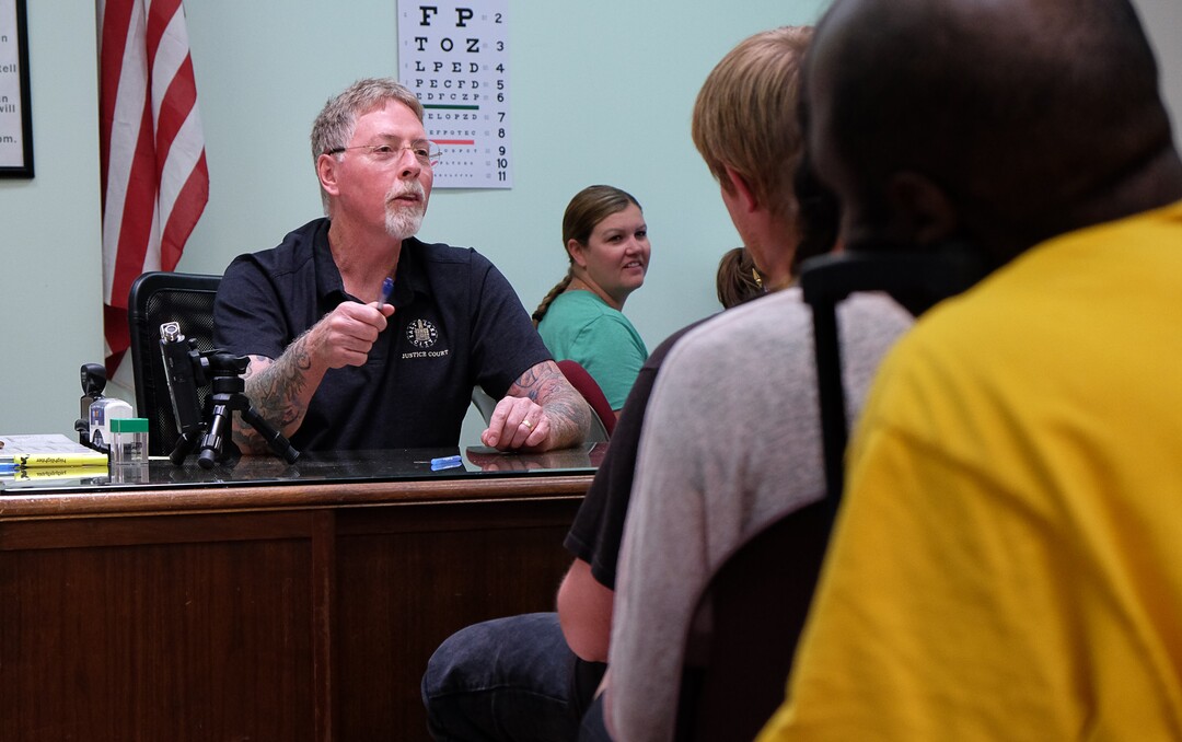 (Francisco Kjolseth  |  The Salt Lake Tribune) Judge John L. Baxter lays out the process of during court held for homeless or transient people in the Weigand Center in Salt Lake City, June 28, 2019. Since May 2004, Salt Lake City has operated a homeless court, where transients can handle misdemeanor charges without showing up in regular court. This helps the homeless person by clearing outstanding warrants they have in a less intimidating environment and it also benefits the regular court by reducing its backlog of such cases. It's part of a larger effort on the part of the American Bar Association to decriminalize homelessness.