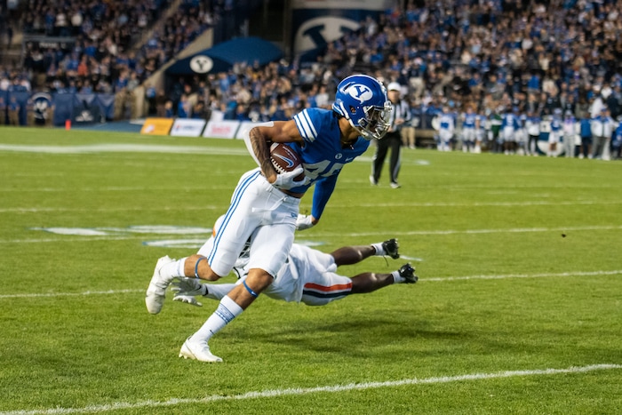 (Trevor Christensen | Special to The Tribune) Brigham Young University's Samson Nacua runs the ball against Virginia during the first half at LaVell Edwards Stadium on Saturday, Oct. 30, 2021, in Provo.
