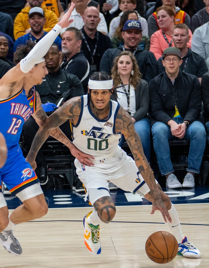 (Rick Egan | The Salt Lake Tribune) Utah Jazz guard Jordan Clarkson (00) drives up the middle, as Oklahoma City Thunder forward Lindy Waters III (12) defends, in NBA action between the Utah Jazz and the Oklahoma City Thunder at Vivint Arena, on Wednesday, April 6, 2022.
