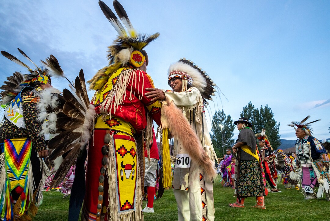 (Leah Hogsten | The Salt Lake Tribune Herman Schildt, member of the Blackfeet Tribe, right, greets Damon Polk, a member of the San Carlos Apache and Quechan Indian Tribes at the 41st Annual Paiute Indian Tribe of Utah Restoration Gathering, Aug. 13, 2021 in Cedar City, Utah.