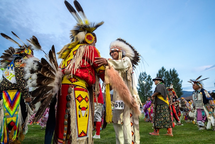 (Leah Hogsten | The Salt Lake Tribune Herman Schildt, member of the Blackfeet Tribe, right, greets Damon Polk, a member of the San Carlos Apache and Quechan Indian Tribes at the 41st Annual Paiute Indian Tribe of Utah Restoration Gathering, Aug. 13, 2021 in Cedar City, Utah.