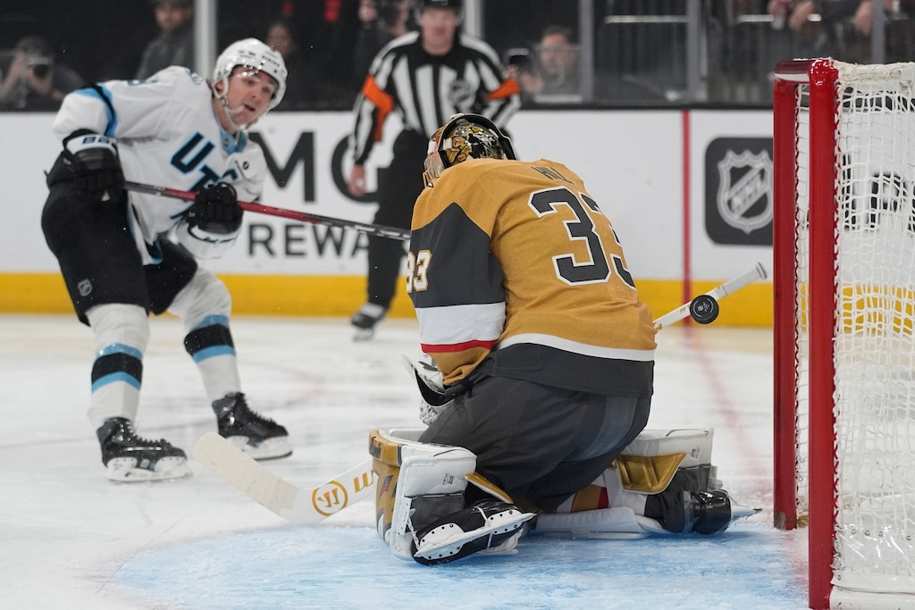 (John Locher | AP) Utah Mammoth right wing Clayton Keller (9) scores on Vegas Golden Knights goaltender Adin Hill (33) during a game in March.