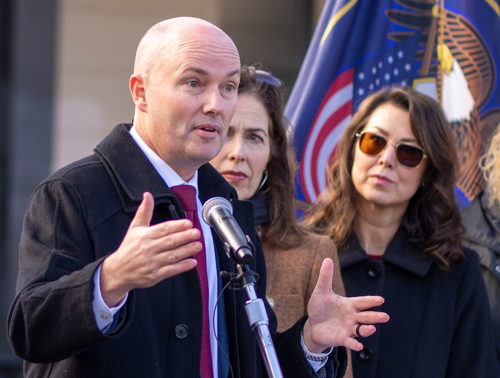 (Rick Egan | The Salt Lake Tribune) Gov. Spencer Cox, joined by state and local officials, speaks in West Valley City on Monday, Dec. 4, 2023.