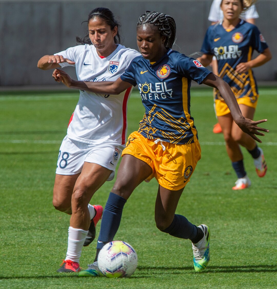 (Rick Egan  |  The Salt Lake Tribune)  Utah Royals FC midfielder Aminata Diallotakes the ball downfield as midfielder Shirley Cruz defends for Ol Reign FC, in soccer action between Utah Royals FC and Ol Reign FC at Rio Tinto Stadium in Sandy, Saturday, Sept. 26, 2020.