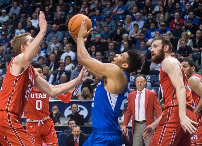 (Rick Egan  |  The Salt Lake Tribune)  Brigham Young Cougars forward Yoeli Childs (23) is guarded by Utah Utes forward Tyler Rawson (21) and Utah Utes forward David Collette (13), in basketball action Utah Utes vs. Brigham Young Cougars at the Marriott Center in Provo, Saturday, December 15, 2017.


