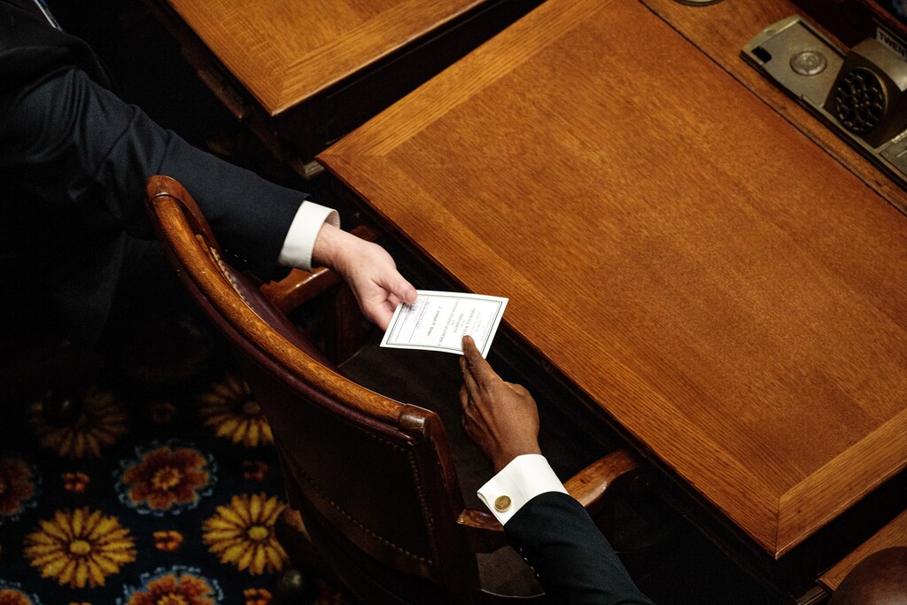 (Damon Winter | New York Times file photo) Electors in Georgia turn in their official ballots on Monday, Dec. 14, 2020, in Atlanta.