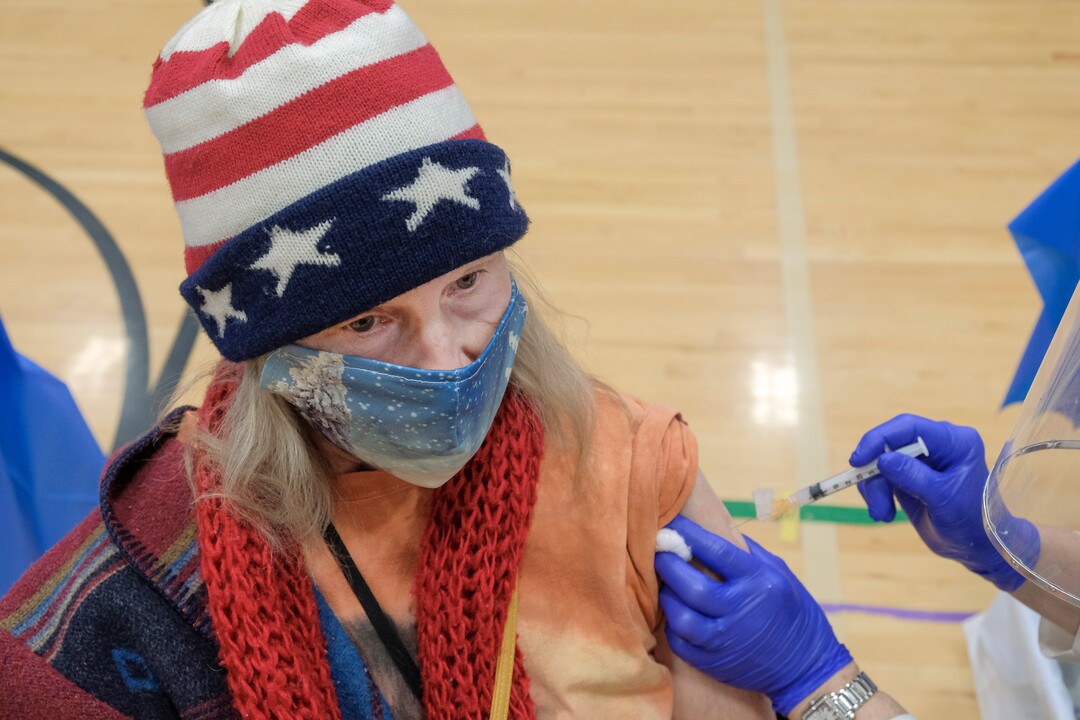 (Leah Hogsten | The Salt Lake Tribune) Karen Johnson, a grief counselor with the Jordan Family Education Center receives her second covid-19 vaccination on Friday. Employees of the Jordan School District were invited to West Hills Middle School to receive their coronavirus vaccination, Feb. 12, 2021.