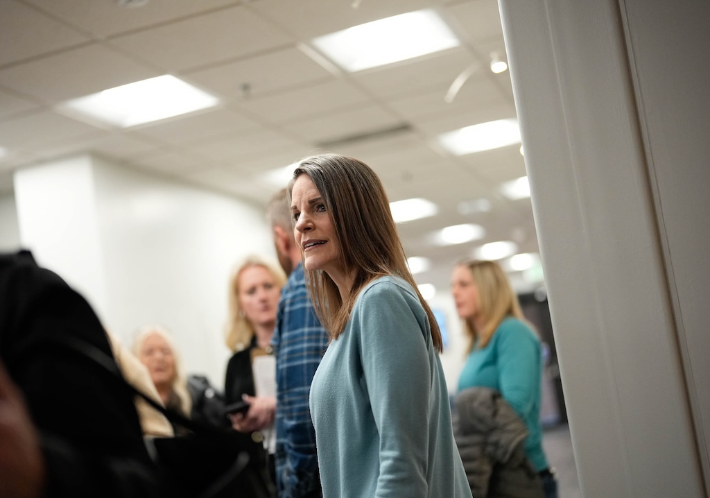 (Francisco Kjolseth  |  The Salt Lake Tribune) Utah State Board of Education member Natalie Cline is surrounded by supporters in the hallway during a board meeting on Thursday, March 7, 2024.
