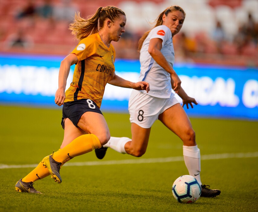 (Trent Nelson  | Tribune file photo) Utah Royals FC forward Amy Rodriguez (8) is defended by Sky Blue FC defender Erica Skroski (8) as Utah Royals FC hosts Sky Blue FC at Rio Tinto Stadium in Sandy on Saturday, June 15, 2019.
