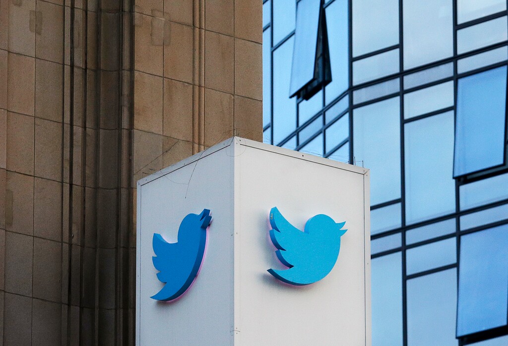 FILE - This Oct. 26, 2016 file photo shows a Twitter sign outside of the company's headquarters in San Francisco. Some political die-hards are getting caught up in an expanded effort by Twitter and other social media companies to crack down on nefarious tactics suspected of interfering in the 2016 election. They have been flagged as "bots," or robot-like automated accounts, because they tweet prolifically. (AP Photo/Jeff Chiu, File)
