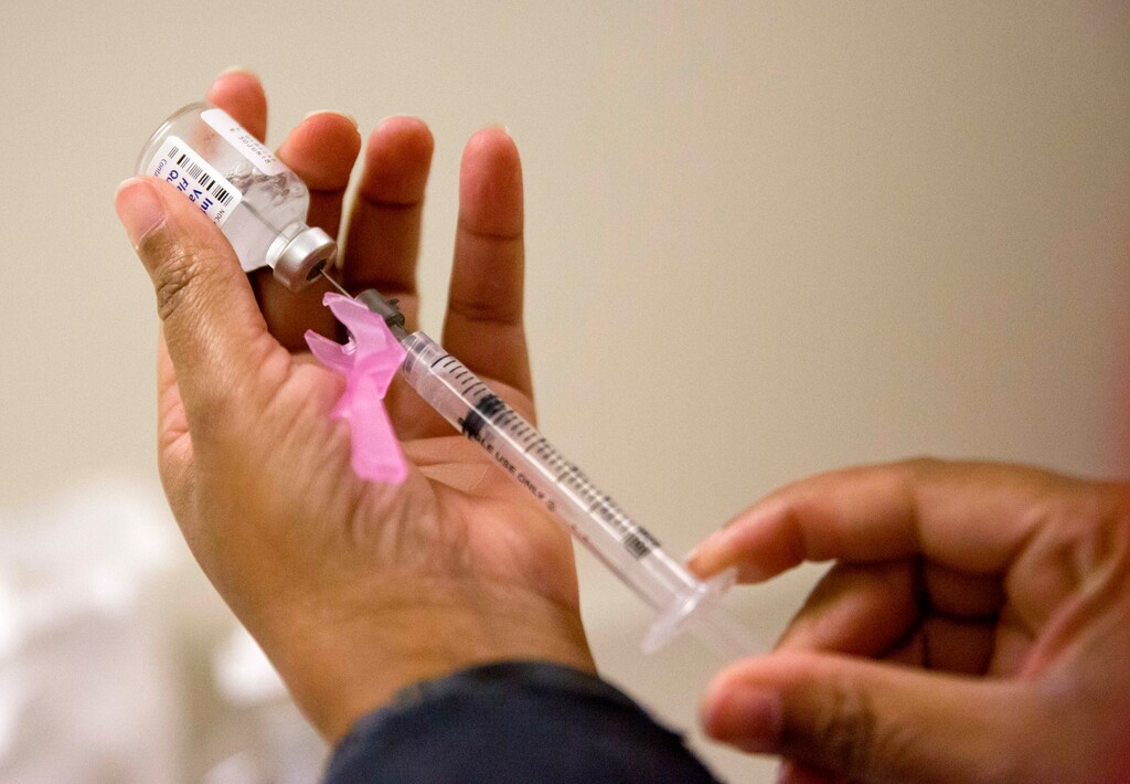 (David Goldman | AP file photo) In this Feb. 7, 2018 file photo, a nurse prepares a flu shot at the Salvation Army in Atlanta. The Centers for Disease Control and Prevention says Wyoming, Utah and Idaho rank among the bottom 10 states for adult flu vaccination.