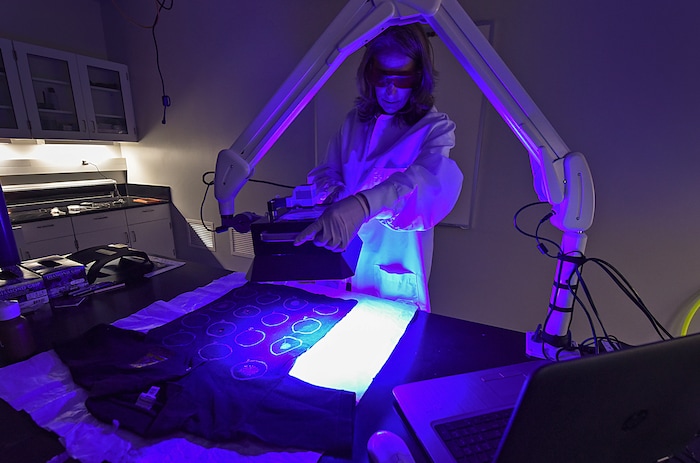 (Francisco Kjolseth | The Salt Lake Tribune) Pilar Shortsleeve, Chief Forensic Scientist talks about some of the tools the office of the medical examiner uses to possibly augment evidence that might be involved in a rape, including using lights of various wave lengths to reflect different types of stains or fluids on materials such as clothing on bedding on Wed. June 6, 2018. A new tracking system provides sexual assault survivors with the ability to anonymously track the location and status of their Sexual Assault Kit from point of collection through forensic analysis. The tracking system provides real-time information to sexual assault survivors regardless of when and where their sexual assault kit was collected in the state of Utah.