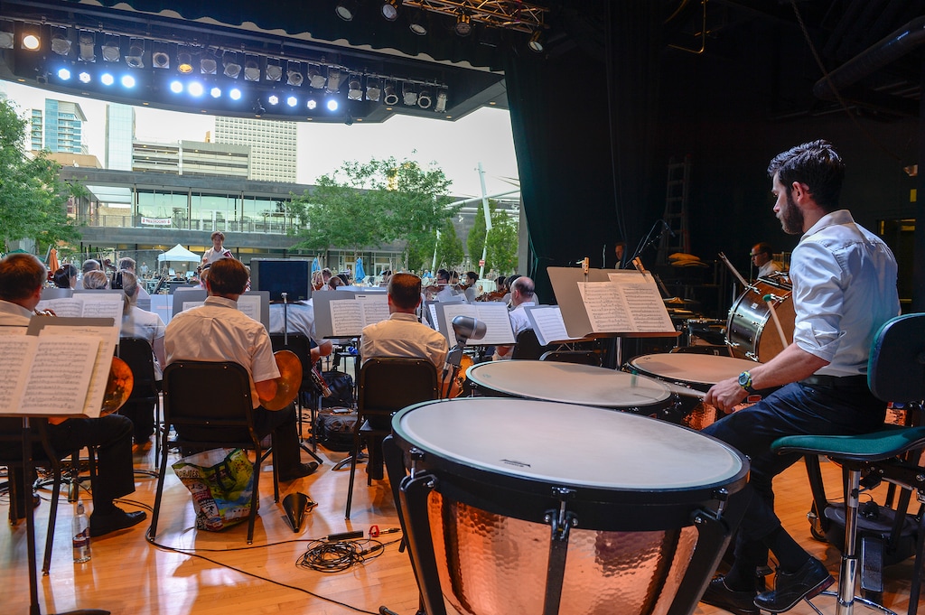 Leah Hogsten | The Salt Lake Tribune Timpani drummer Eric Hopkins and fellow members of the Utah Symphony as they perform Jose Pablo Moncayo's Huapango, Wolfgang Amadeus Mozart's Symphony No. 25, Arturo Marquez's Danzon No. 2 and Antonin Dvorak's Symphony No. 8 at the Gallivan Center, June 25, 2018.
