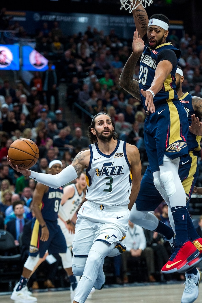 (Chris Detrick  |  The Salt Lake Tribune)  Utah Jazz guard Ricky Rubio (3) runs around New Orleans Pelicans forward Anthony Davis (23) during the game at Vivint Smart Home Arena Friday, December 1, 2017.  