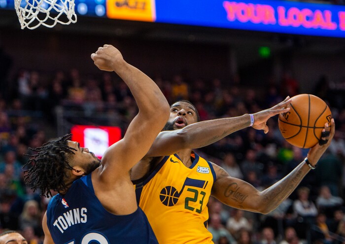 (Rick Egan  |  The Salt Lake Tribune)     Utah Jazz forward Royce O'Neale (23) takes the ball to the basket as Minnesota Timberwolves center Karl-Anthony Towns (32) defends, in NBA action between the Utah Jazz and the Minnesota Timberwolves in Salt Lake City, Monday, Nov. 18, 2019.