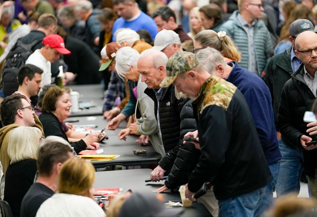 (Bethany Baker  |  The Salt Lake Tribune) Caucusgoers sign in ahead of the presidential primary caucuses at Riverton High School in Riverton on Tuesday, March 5, 2024.