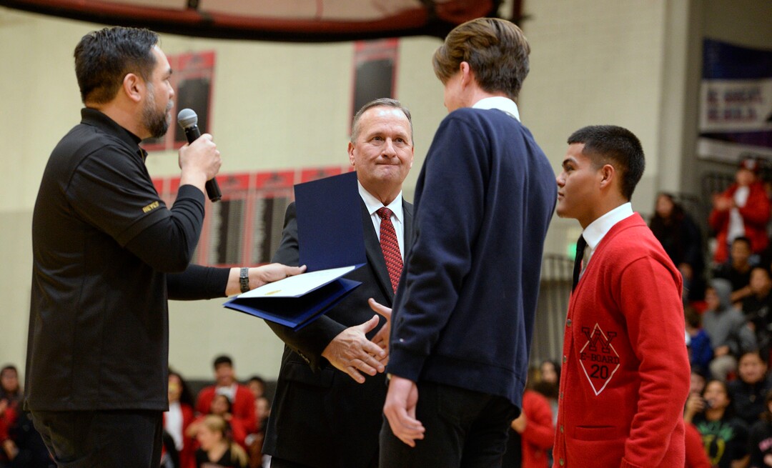 (Leah Hogsten  |  The Salt Lake Tribune) l-r Utah Attorney General Sean D. Reyes introduces Assistant Attorney General David Carlson to West High School student, Grant Dunkley and Felix Ortiz during an assembly at the school, Jan. 17, 2020. One year ago, on February 19, 2019, Dunkley and Ortiz assisted Carlson out of his overturned car on the 600 North bridge in Salt Lake City where Ortiz performed life-saving CPR until first responders arrived on the scene.