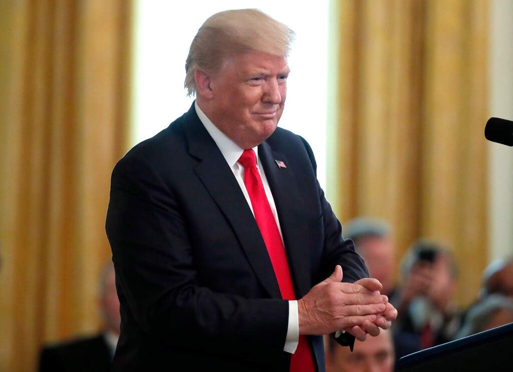 President Donald Trump applauds during a Medal of Honor ceremony for Air Force Tech. Sgt. John A. Chapman, awarded posthumously for conspicuous gallantry, during a ceremony in the East Room of the White House, Wednesday, Aug. 22, 2018, in Washington. (AP Photo/Alex Brandon)