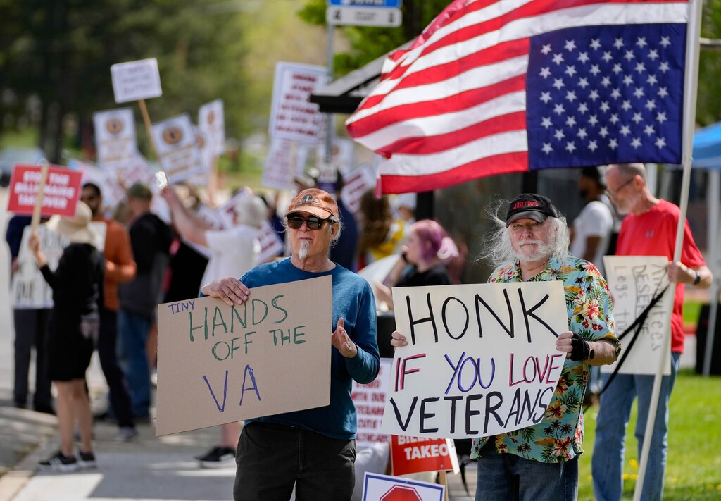 (Francisco Kjolseth | The Salt Lake Tribune) Steven Carter, left, and disabled veteran John Colaizzi, join the “Let Our Voices Be Heard" rally at the Salt Lake City Veterans Affairs hospital on Saturday, April 26, 2025. The medical center is not accepting new patients for inpatient behavioral health treatment.
