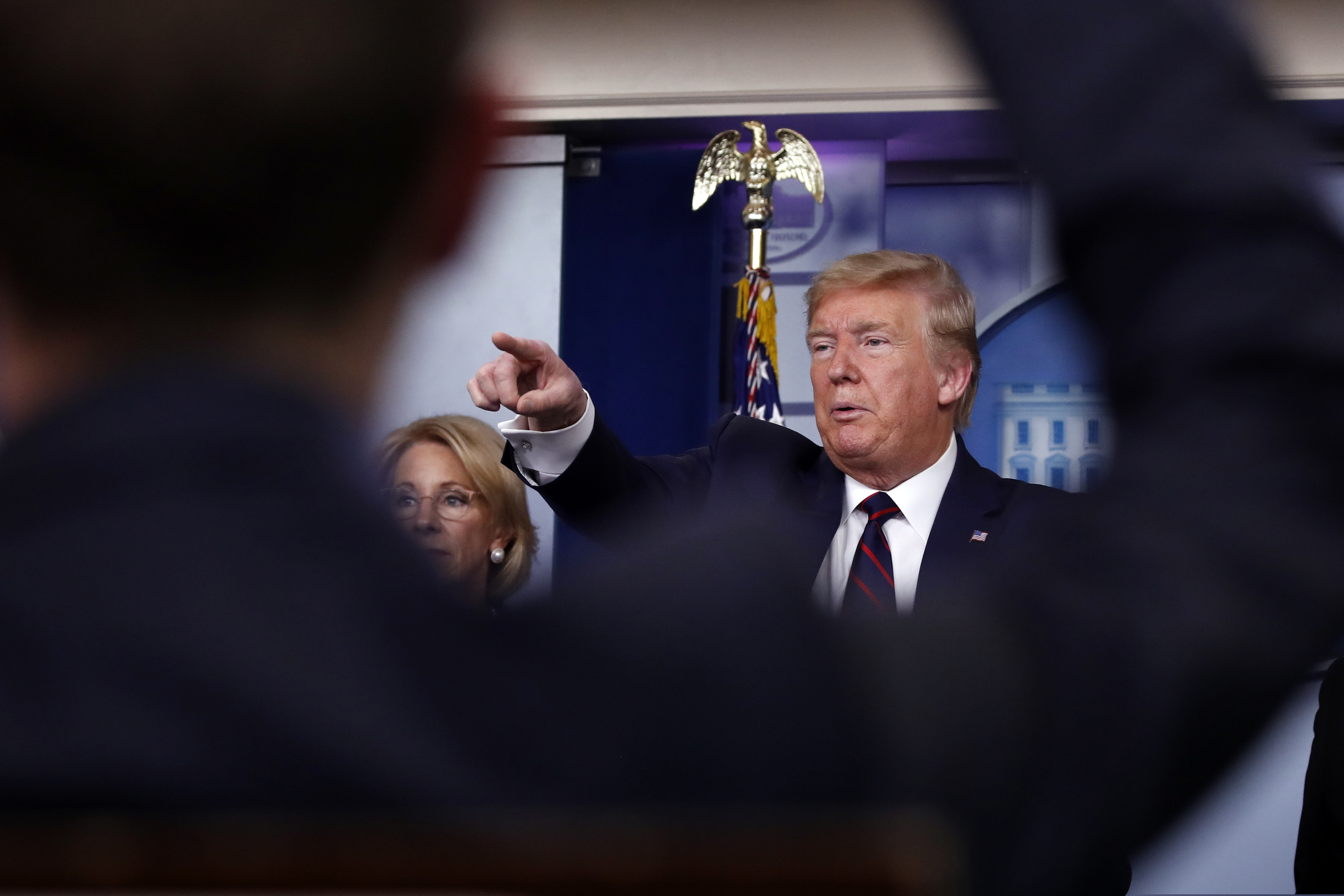 (Alex Brandon | AP)  President Donald Trump takes questions from reporters as he speaks about the coronavirus in the James Brady Press Briefing Room, Friday, March 27, 2020, in Washington.