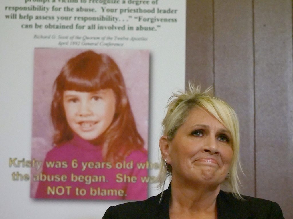 Kristy Johnson speaks during a news conference Thursday, June 28, 2018, in Salt Lake City. Johnson, a California woman suing her father for sexual abuse that occurred during her childhood, says Mormon church leaders allowed the sexual assault to continue by failing to report it to police. Johnson said that her now-deceased mother told local church leaders about the abuse multiple times during the 1960-1970s. (AP Photo/Rick Bowmer)
