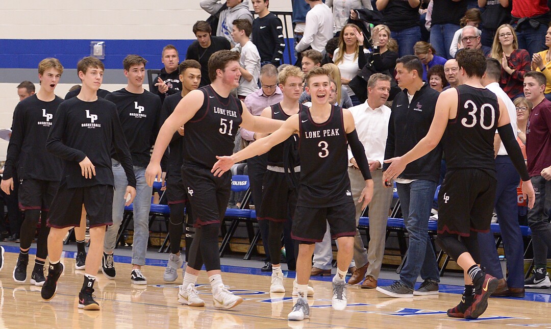 (Leah Hogsten  |  The Salt Lake Tribune)  Lone Peak celebrates the win. Lone Peak High School boys' basketball team defeated Pleasant Grove High School 65-61 during their game Friday, January 26, 2018 in Pleasant Grove. 