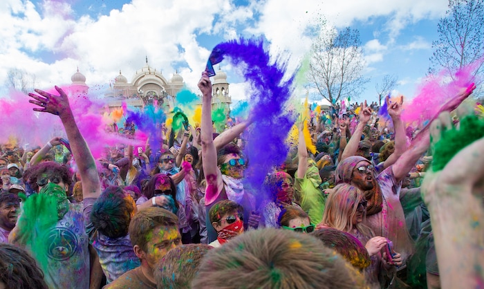 (Rick Egan  |  The Salt Lake Tribune)   Revelers toss colored powder into the air as they celebrate the arrival of spring, during the Holi Festival of Colors celebration at the Sri Sri Radha Krishna Temple in Spanish Fork, Saturday, March 30, 2019.



